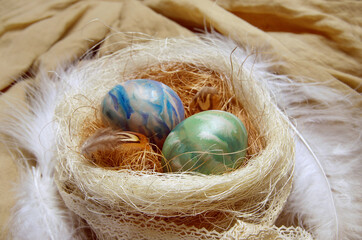 Ostara symbols. Colorized eggs in a nest.