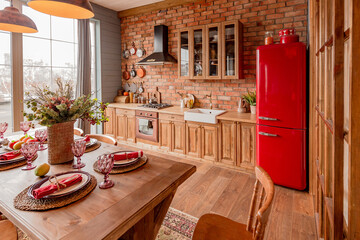 cozy all wooden interior of a country house in a wooden design. spacious living room with kitchen area with large windows. bedroom on the second floor.