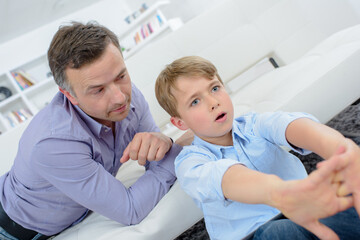 Fototapeta premium dad while his boy stretching