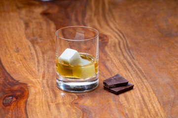 Tasting glass with strong alcoholic spirit drink whisky, cognac, armagnac or calvados