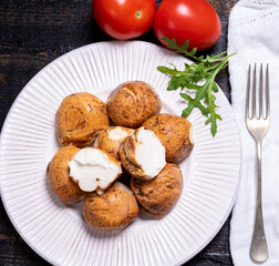 Tasty Italian food, small balls of smoked mozzarella soft cheese