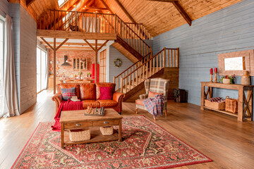 cozy all wooden interior of a country house in a wooden design. spacious living room with kitchen...