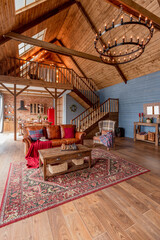 cozy all wooden interior of a country house in a wooden design. spacious living room with kitchen...
