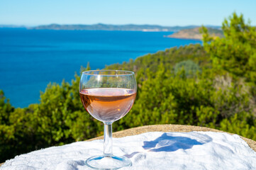 Picnic with of local rose wine and blue Mediterranean sea on background, near Saint-Tropez, Var, Provence, France