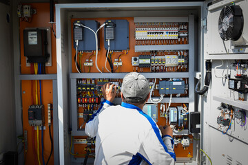 technician working with fuse board