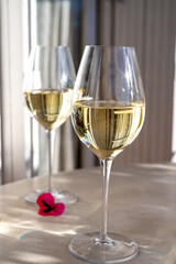 Tasting of local white wine on sunny summer balcony Provence, France