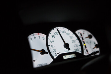 View of car dash board at night