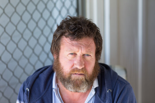 Hairy man looking at camera quizzically