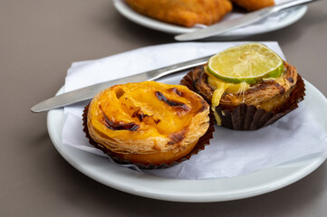 Traditional dessert pastry in Portugal, nata eggs cream cakes with fruits