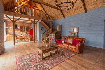 cozy all wooden interior of a country house in a wooden design. spacious living room with kitchen...
