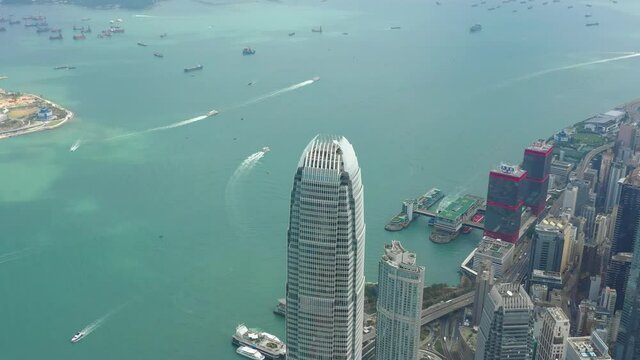 sunny day hong kong cityscape downtown victoria harbour traffic aerial panorama 4k