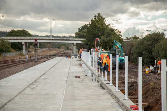 Reflective clothing at a construction site next to train station