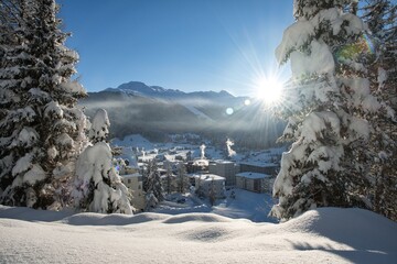 Fototapeta na wymiar Beautiful sunrise after heavy snowfall in the Swiss Mountains Alps at Davos
