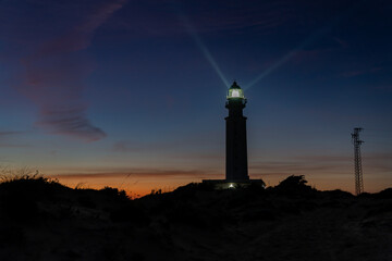 the Cape Trafalgar lighthouse signal light after sunset with colorful evening sky