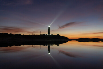 the Cape Trafalgar lighthouse signal light after sunset with colorful evening sky