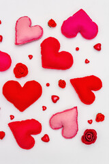 Assorted red and pink hearts isolated on white background