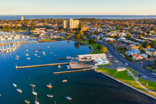 Aerial view of long piers and yachts in a bay side boat club