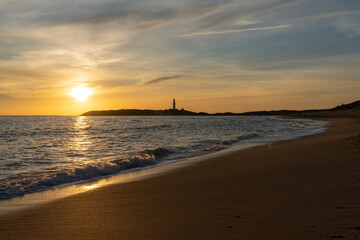 sunset on the Playa de Maria Sucia Beach with the Cape Trafalgar Lighthouse in the background