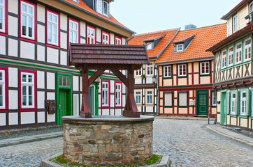 The old stone well in the street, Wernigerode, Germany