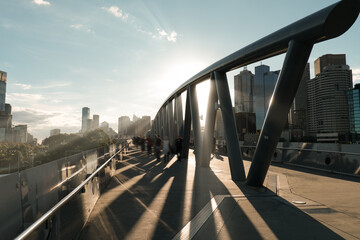 Sunlight shining through architecture with blurred people, Birrarung Marr