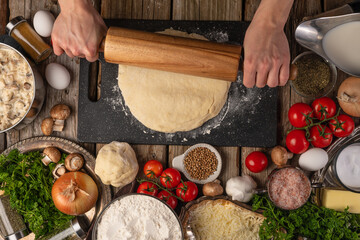 The chef prepares and works with the dough making italian pizza or pasta. Cooking Ingredients Top View Cooking Cooking Concept and Recipe Book