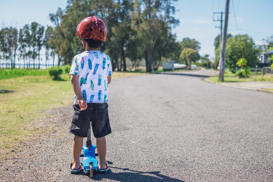a boy with his scooter, exploring