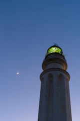 close up view of the Cape Trafalgar Lighthouse and a new moon