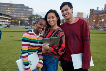 Group of young university students laughing and hanging out on-campus