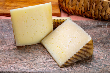 Cheese collection, pieces of hard Spanish manchego curado, viejo and iberico cheeses
