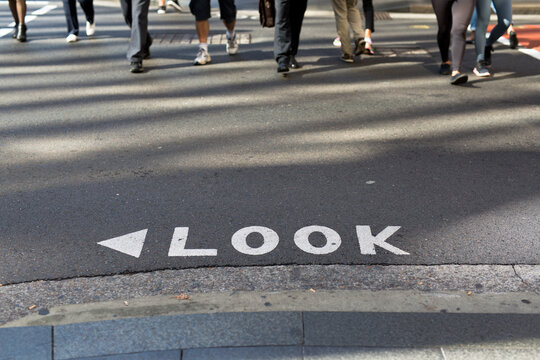 Look sign on a road at a busy intersection in the Sydney CBD