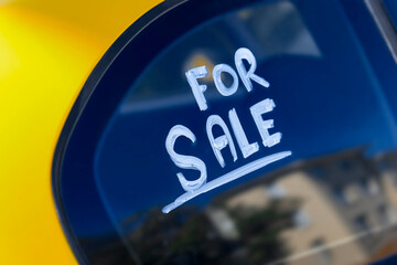 For sale sign on car window