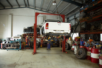 Ute raised for repairs in a mechanic workshop
