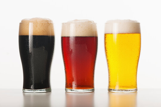 Three beers in glasses, studio shot