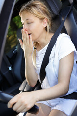 a tired young woman driver