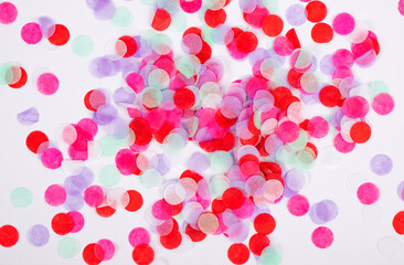 Bright background from colored confetti. Photography for design. Festive texture for design.