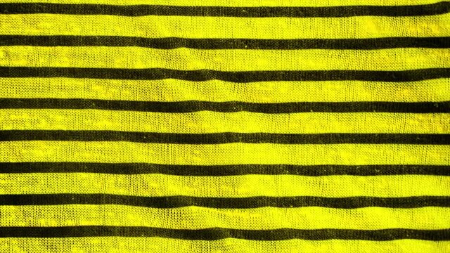 Yellow and black striped pattern texture background. Linen cotton macro shot, decorative woven.