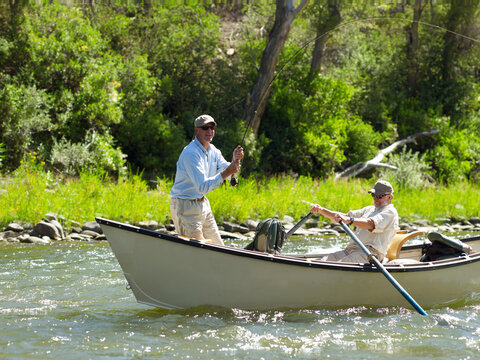 USA, Colorado, Pair of men fly-fishing