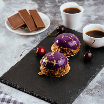 A variety of sweet homemade desserts on a light marble backgroun