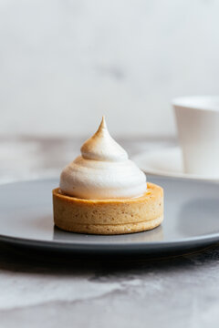 A variety of sweet homemade desserts on a light marble backgroun