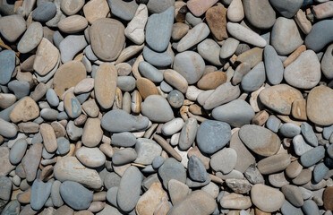 Pebbles or smooth rocks and with light gray texture