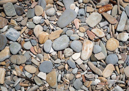 Pebbles or smooth rocks and with light gray texture