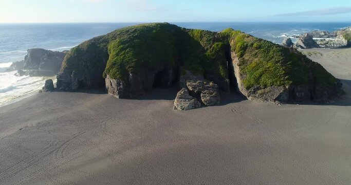 Iglesia de Piedra is a large stand alone rock on the beach with multiple chasm caves inside them.
