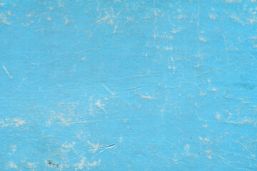 Cardboard blue abstract pattern texture close-up. Retro old paper background. Grunge concrete wall. Vintage blank wallpaper.