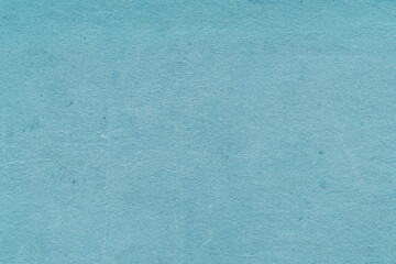 Cardboard blue abstract pattern texture close-up. Retro old paper background. Grunge concrete wall. Vintage blank wallpaper.