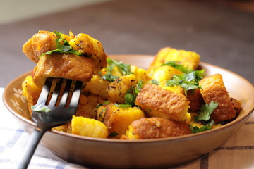 A bowl of homemade freshly prepared Bread Upma, a savory and spicy South Indian bread dish