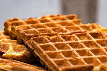 homemade belgian waffles, crispy waffles close-up on the table