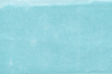 Cardboard blue abstract pattern texture close-up. Retro old paper background. Grunge concrete wall. Vintage blank wallpaper.