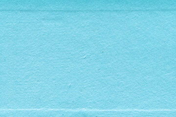 Cardboard blue abstract pattern texture close-up. Retro old paper background. Grunge concrete wall. Vintage blank wallpaper.