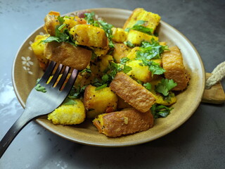 A bowl of homemade freshly prepared Bread Upma, a savory and spicy South Indian bread dish