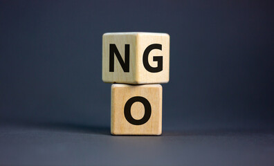 No or go symbol. Turned a cube, changed the word 'no' to 'go'. Beautiful grey background. Copy...